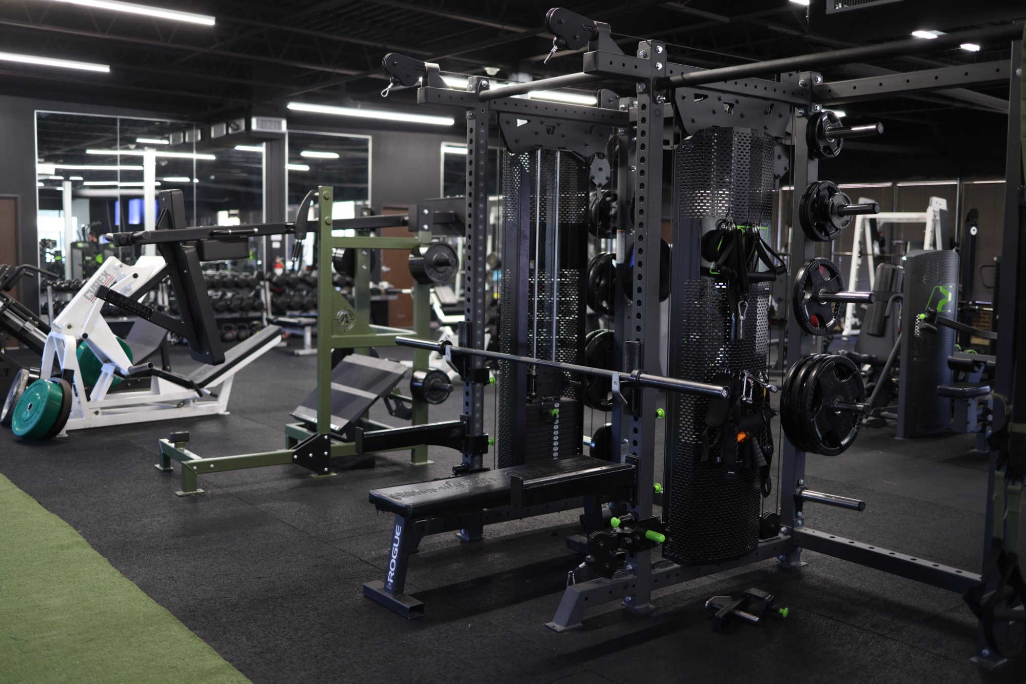 Adapt Fitness — 7,000 SF gym floor with Rogue racks and premium equipment